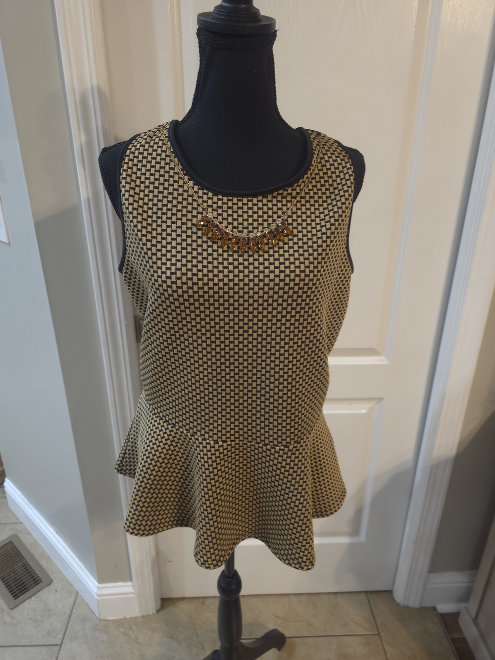 Dots Sleeveless Peplum Tunic in Black and Gold